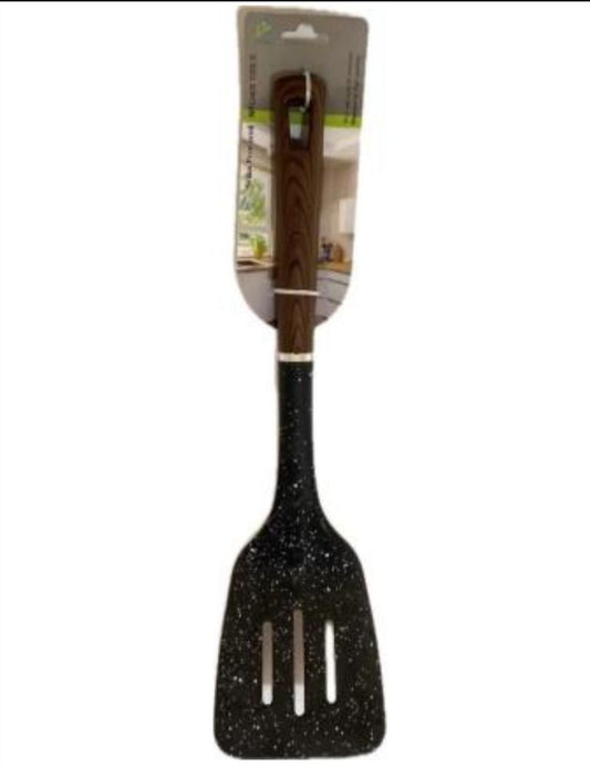 Pala/ espátula  ranurada en Nylon